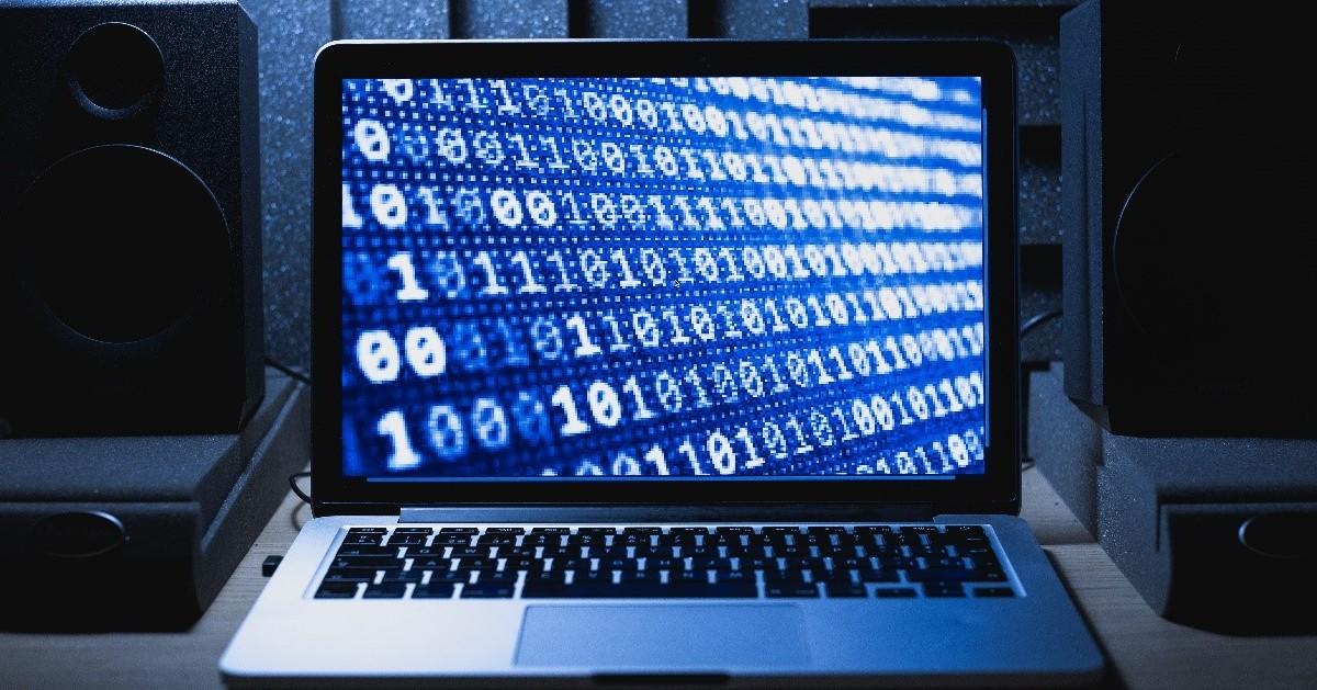 A computer with binary numbers on the screen