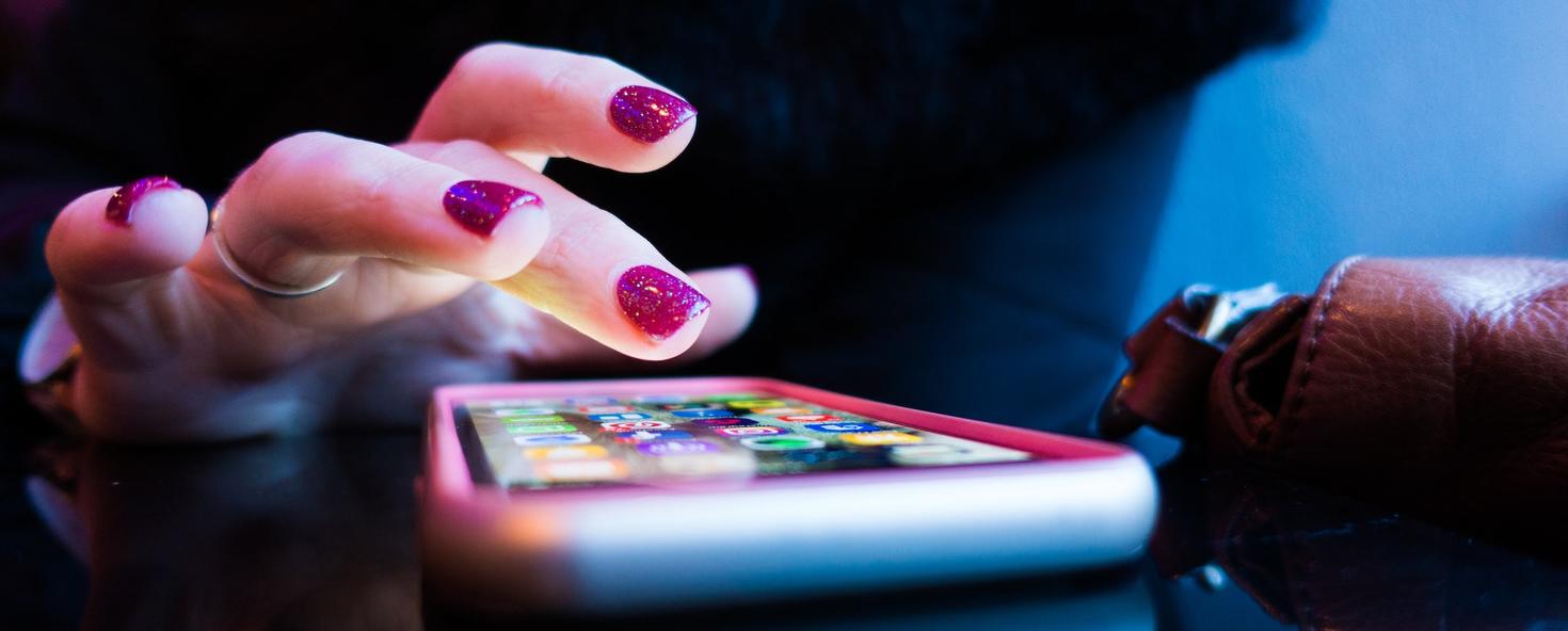 Close-up on fingers typing on a cellphone