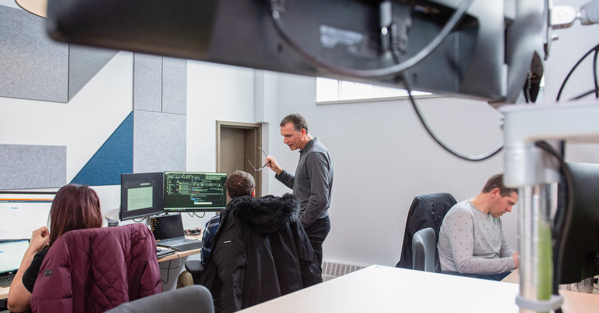 People working in an IT office