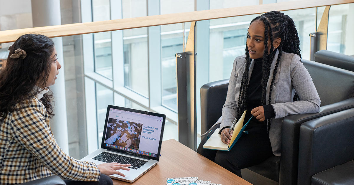 founders of ally squared Uswah Ahsan and Sumaya Sherif having conversation while sitting across from eachother