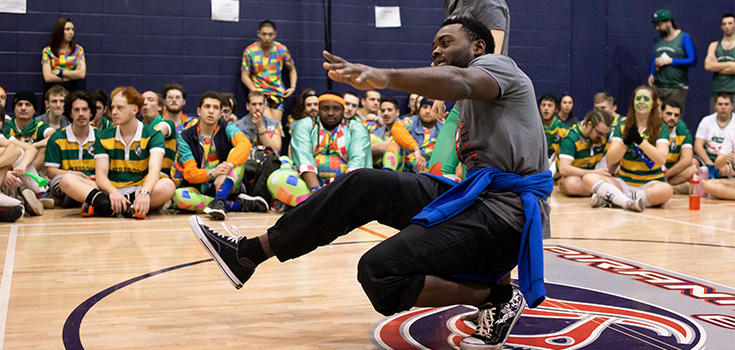 Student dancing in gym
