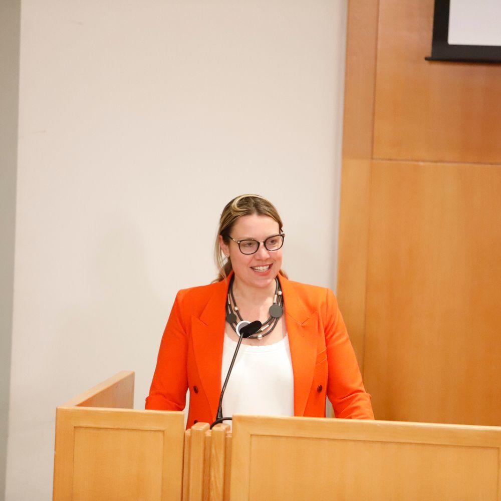 Dean Boon speaking at the podium