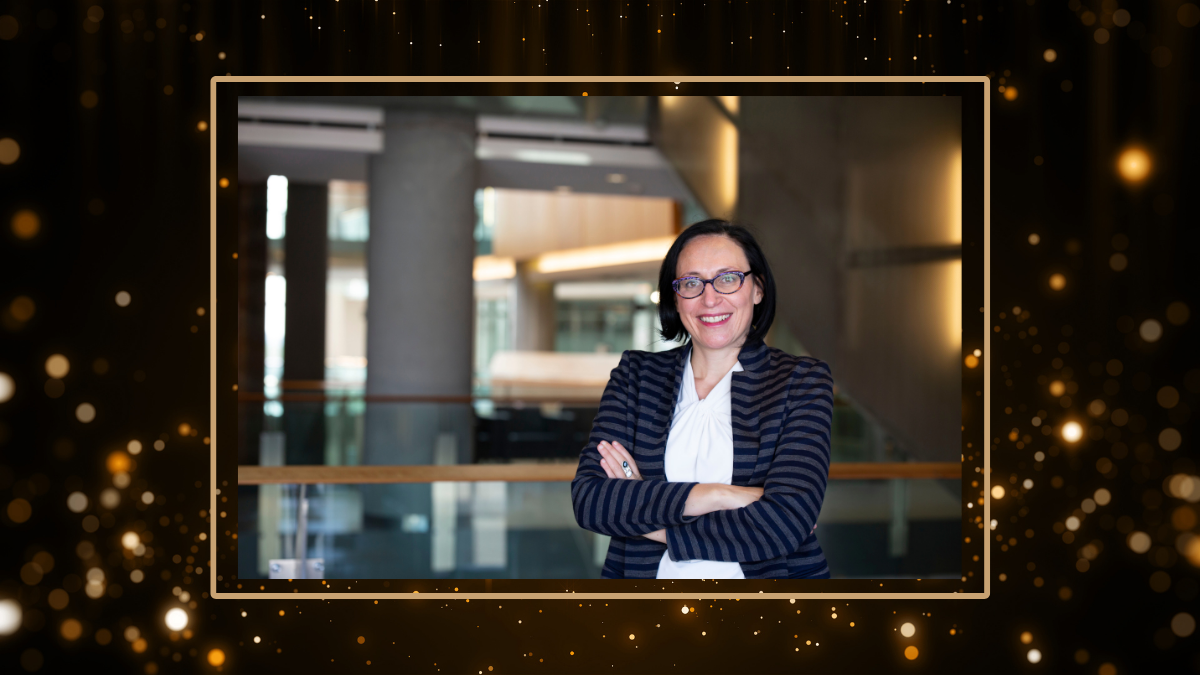 professor Delphine Nakache stands with  her arms crossed