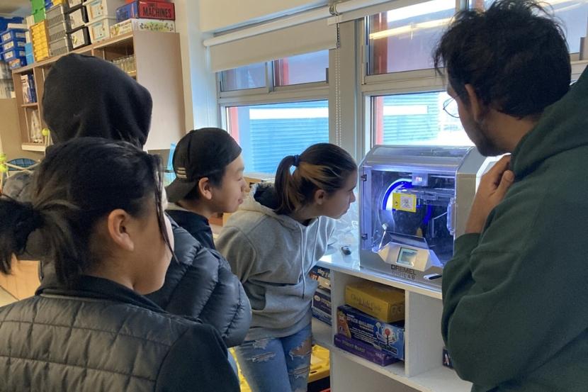 Group of students with a 3D printer.