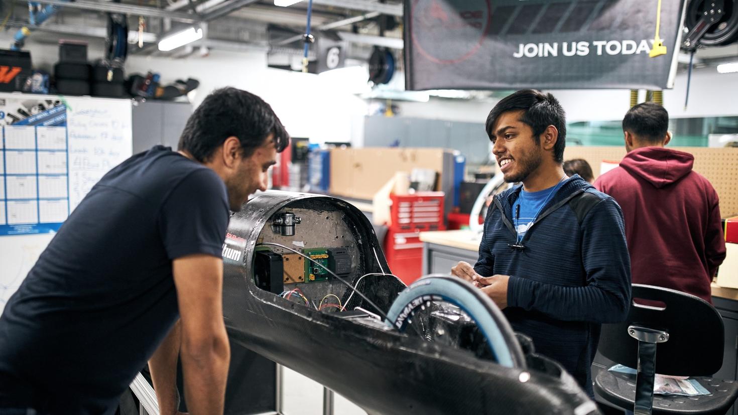 Students working on car in John McEntyre Team Space.