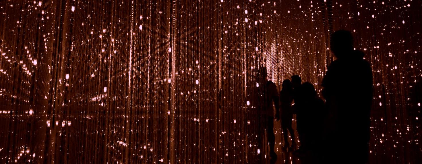 People walking through a digital space.