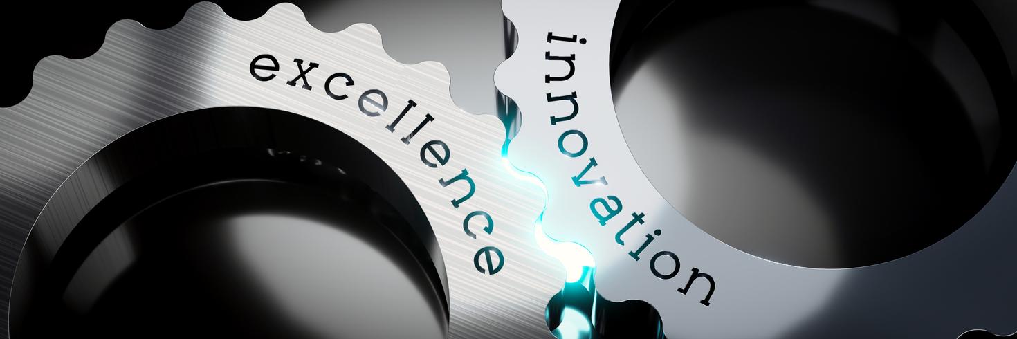 Interlinking metal gears engraved with words excellence and innovation