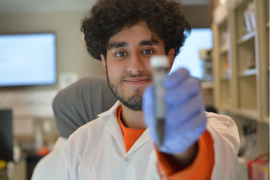 Student holding up test tube