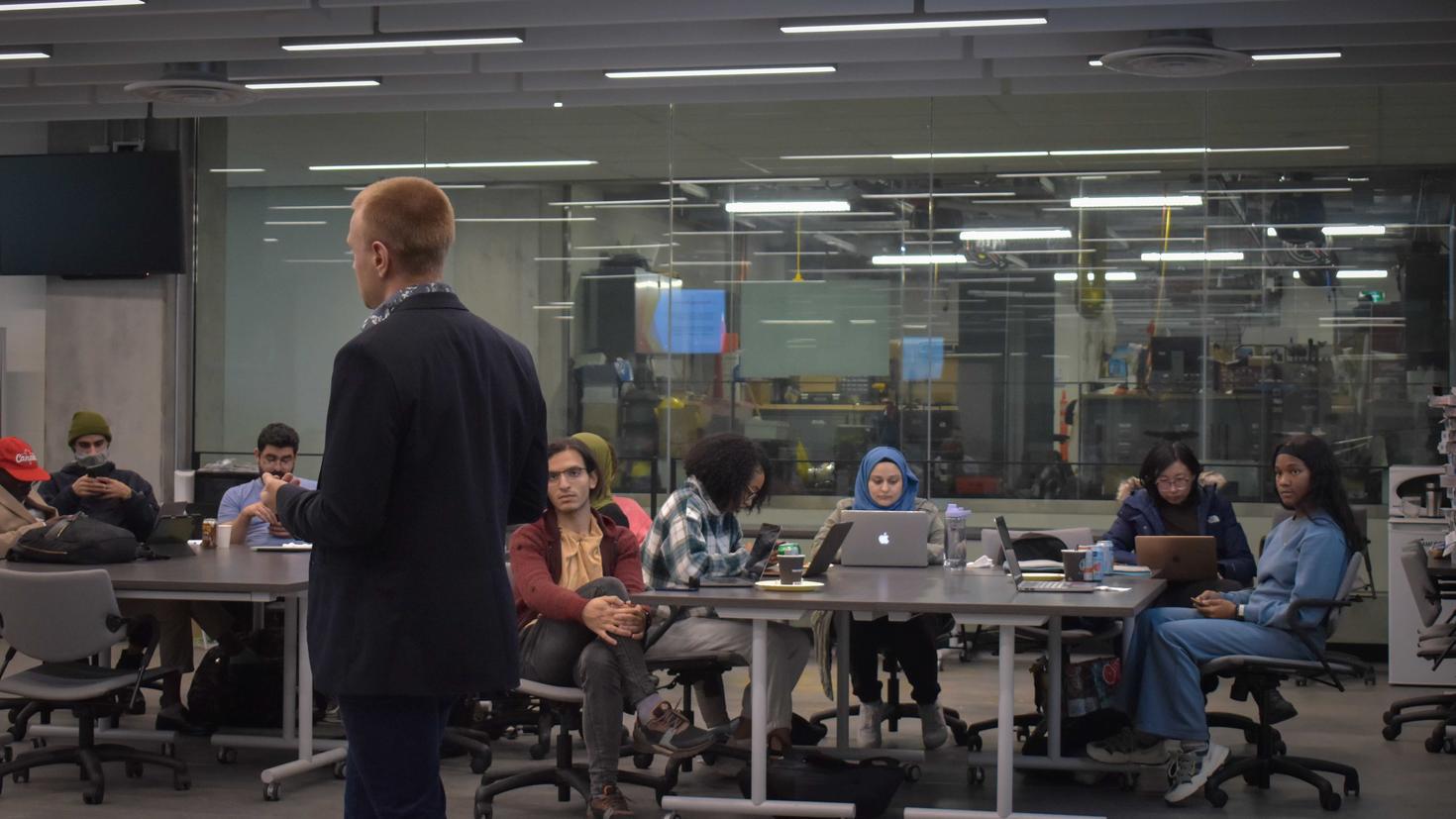 Students listening to a presentation