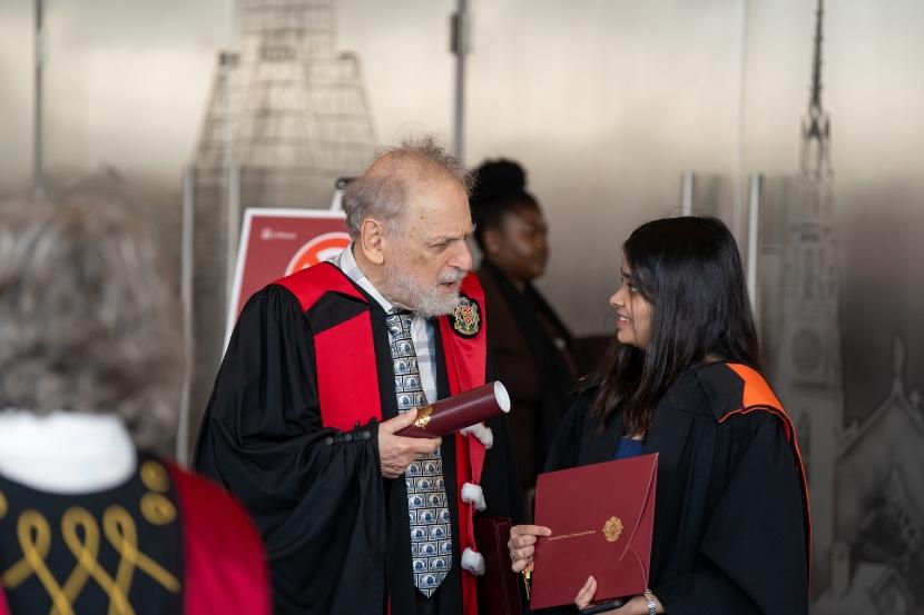 John McEntyre with a graduating student.