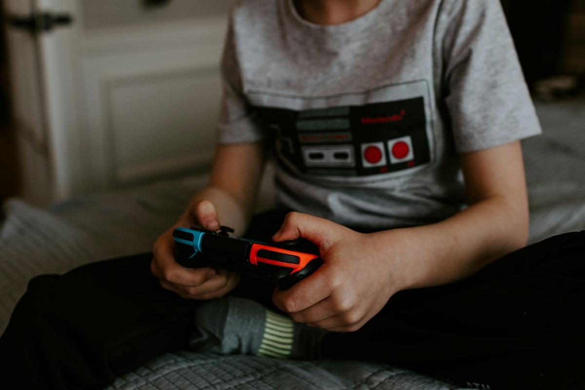 Body of a child playing video games