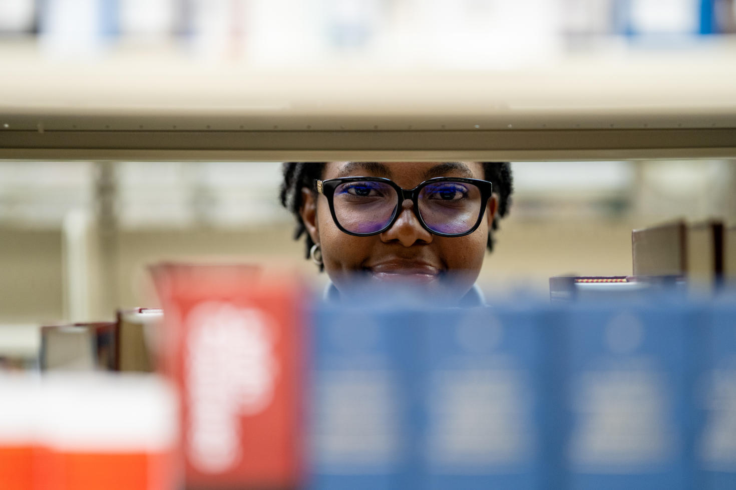A student browsing books