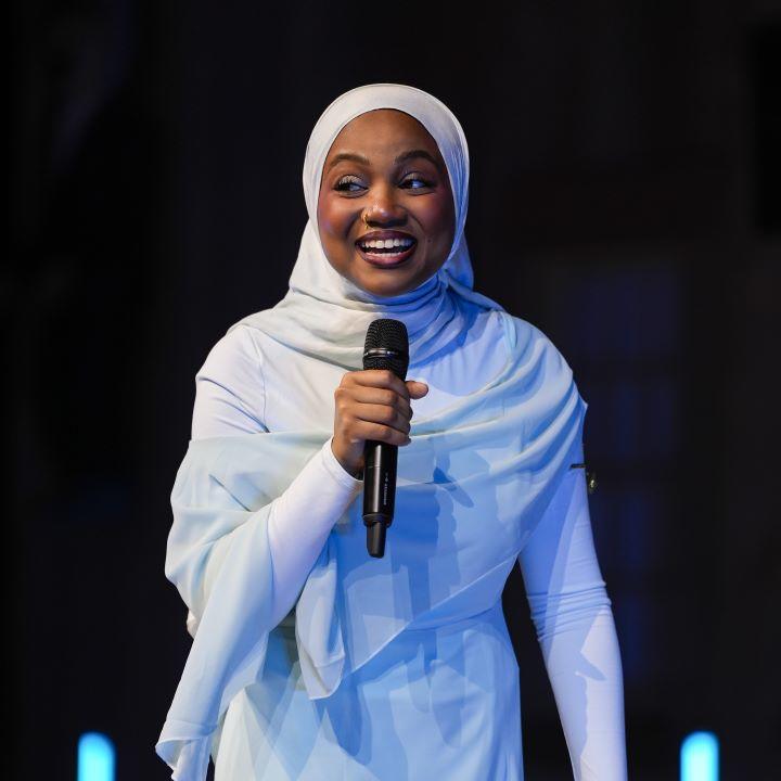 Photo of Aishah Salim speaking at the 2026 Black History Month Gala