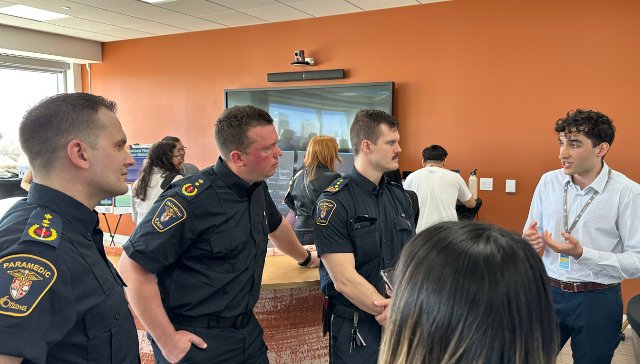 uOttawa medical student Shayan Heybati (right) discusses his project evaluation with Ottawa paramedics.