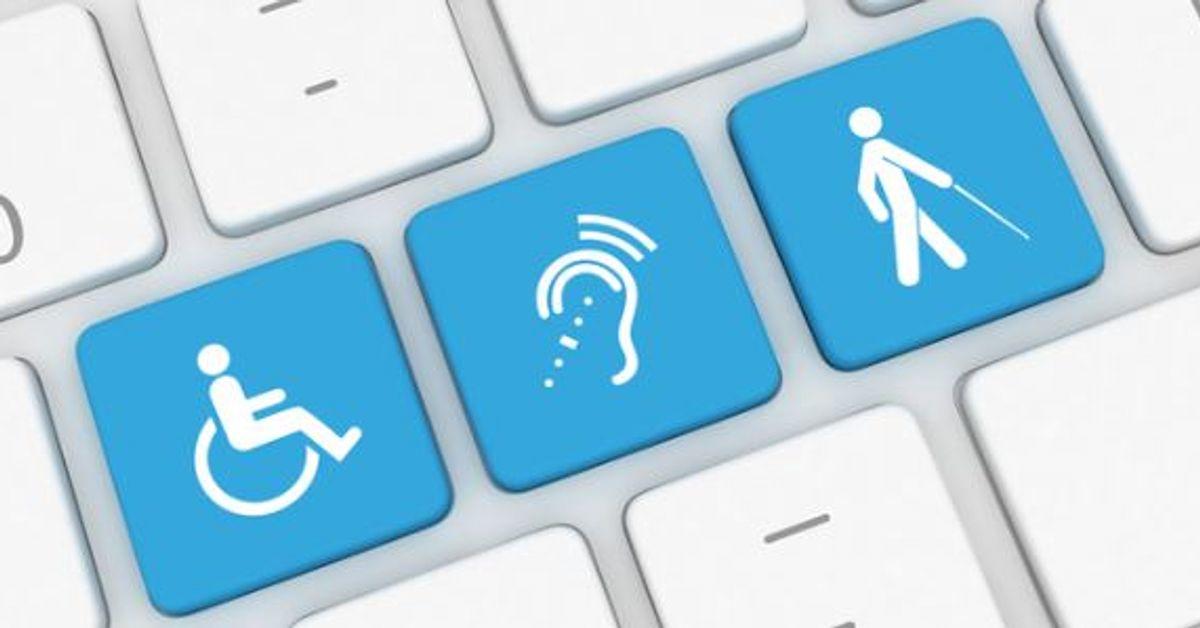 Computer keyboard on which accessibility pictograms are printed on a few keys.
