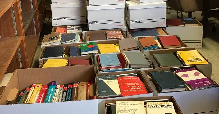 A dozen boxes of books ready to be shipped.