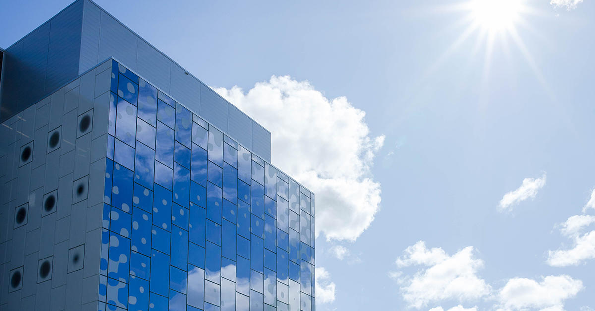 A corner of the STEM complex against a blue a sunny sky