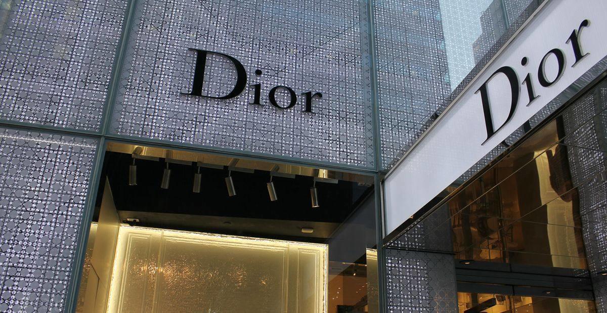 Dior logo on two sides of a shop front.