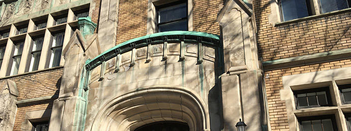 Hagen Hall’s brick exterior, arched entryway and large front doors.