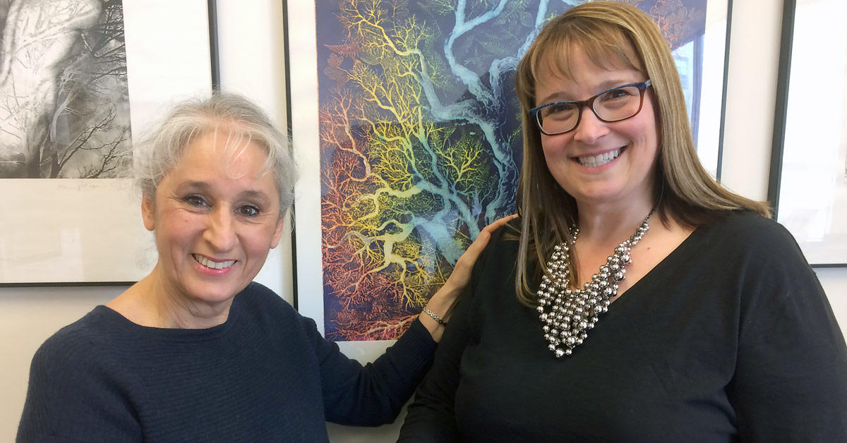 Sylvie Tremblay and Aline Germain-Rutherford holding hands.