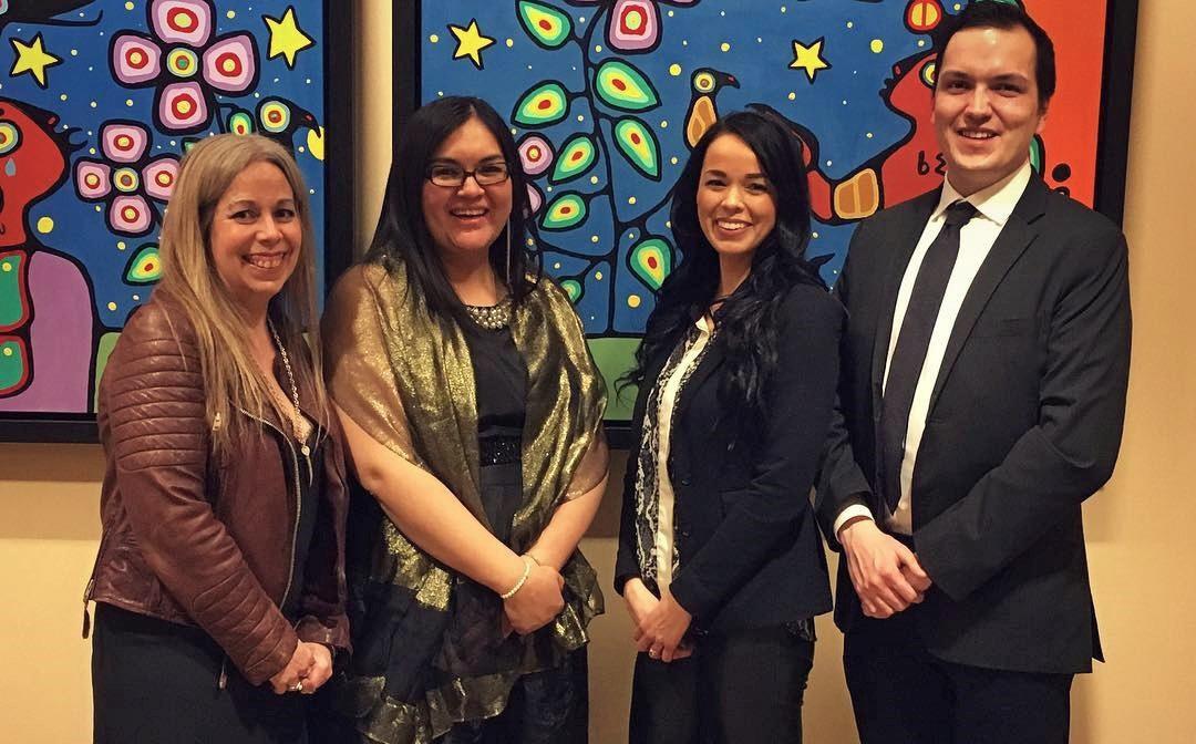New members of the Indigenous Affairs team in front of a painting.