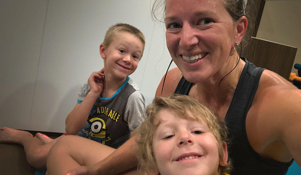 Melanie Bellefeuille in a selfie with her two young boys after a workout