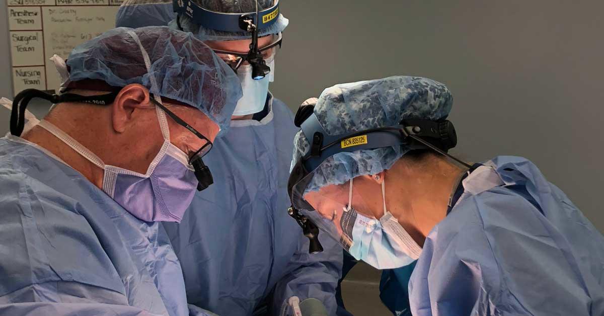 Three physicians from The Ottawa Hospital conducting a medical procedure