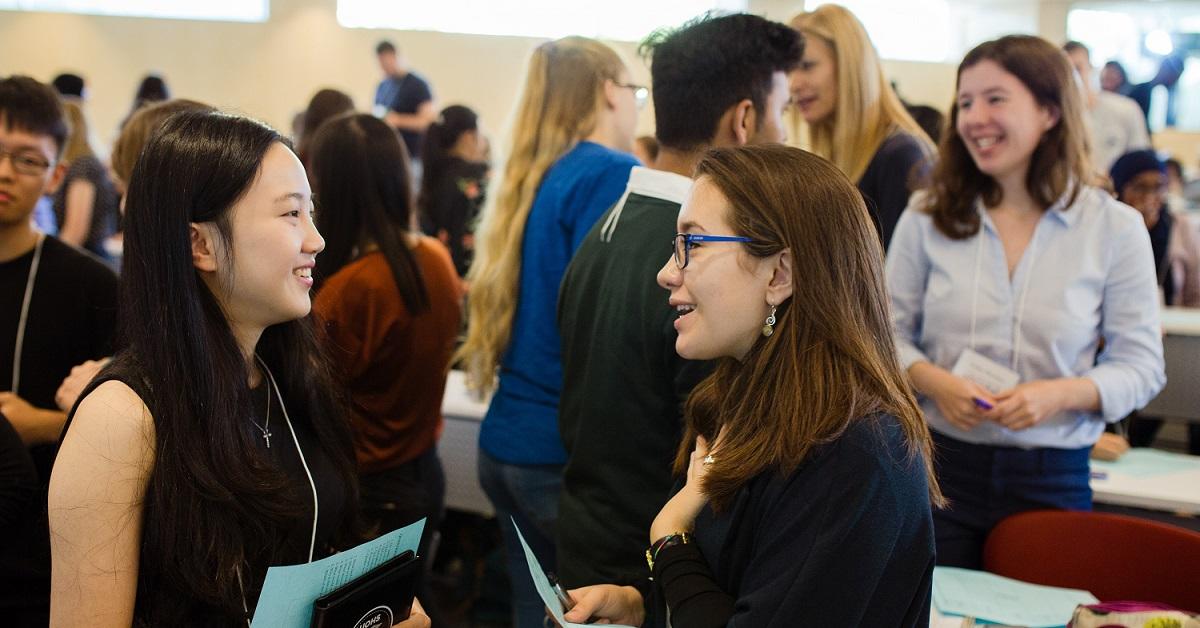 Formal meeting of young students talking to each other