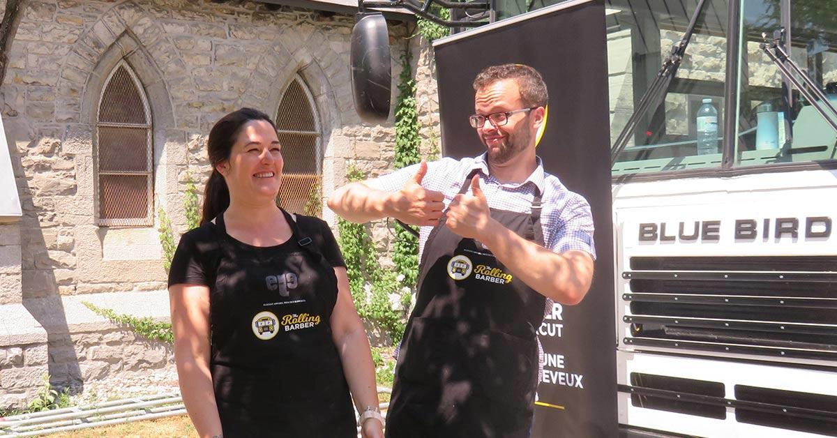 Anne Donovan and François Thibeault in front of the bus.