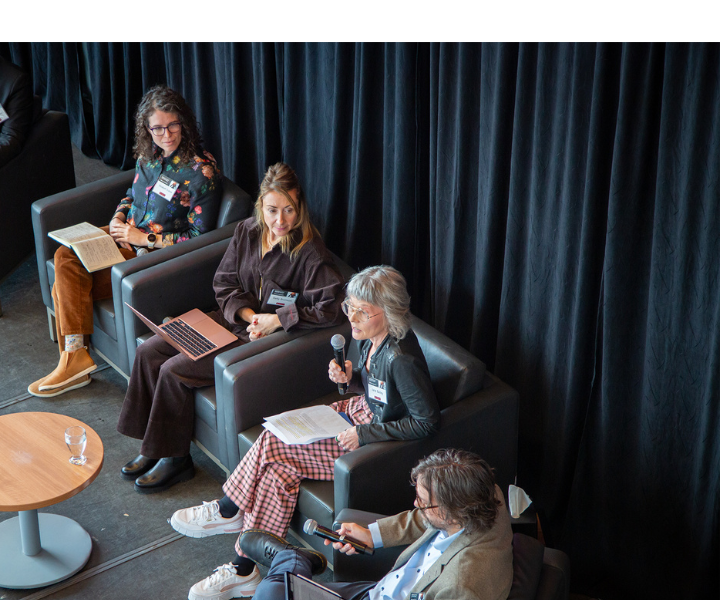 Panelists on stage at the uOttawa AI Symposium seen from above. 