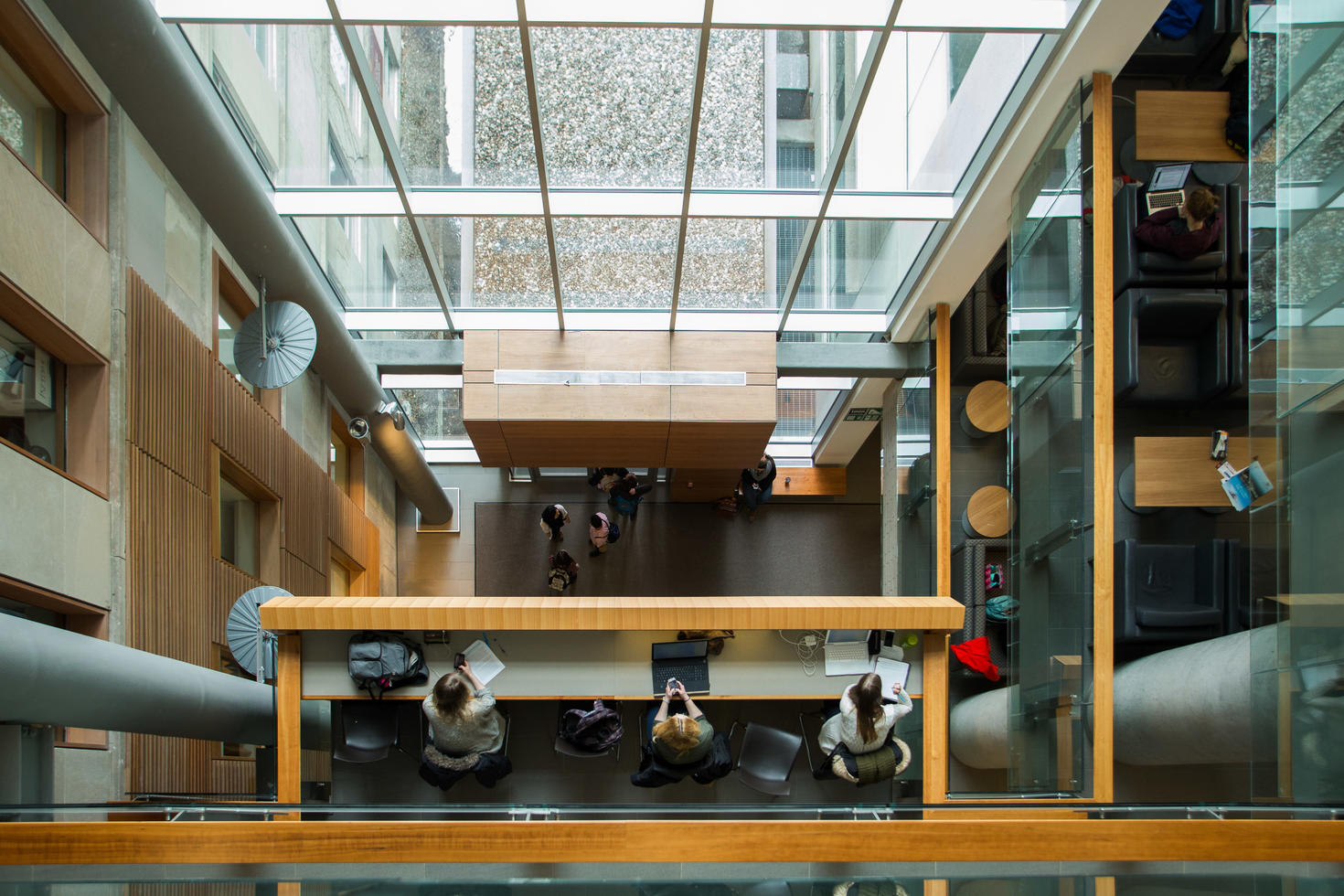 birds eye view of students working in social sciences building