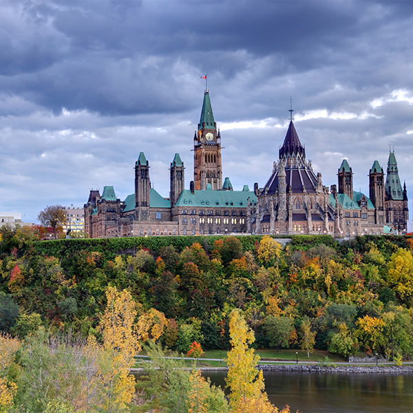 Parliament hill in seen from the Ottawa river in autumn