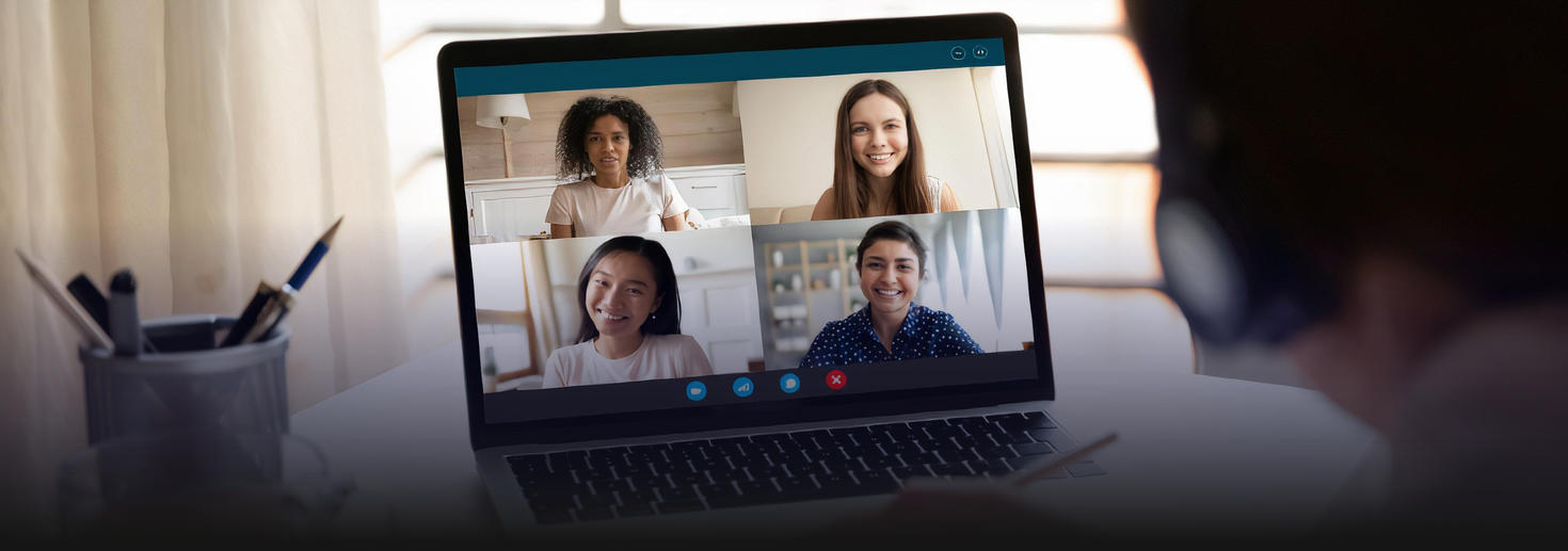 A person engaging in a virtual meeting with four participants