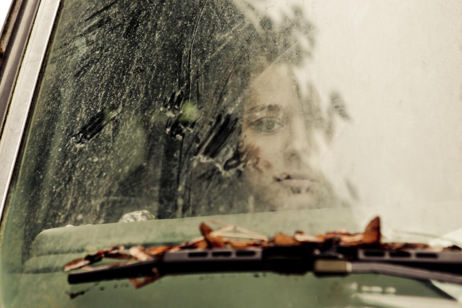 Person looking through window