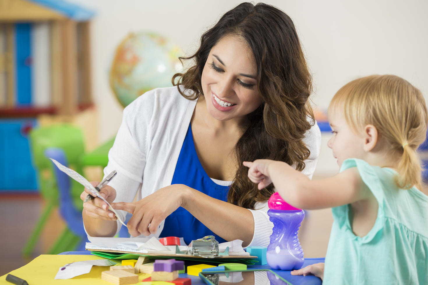 Woman playing with girl