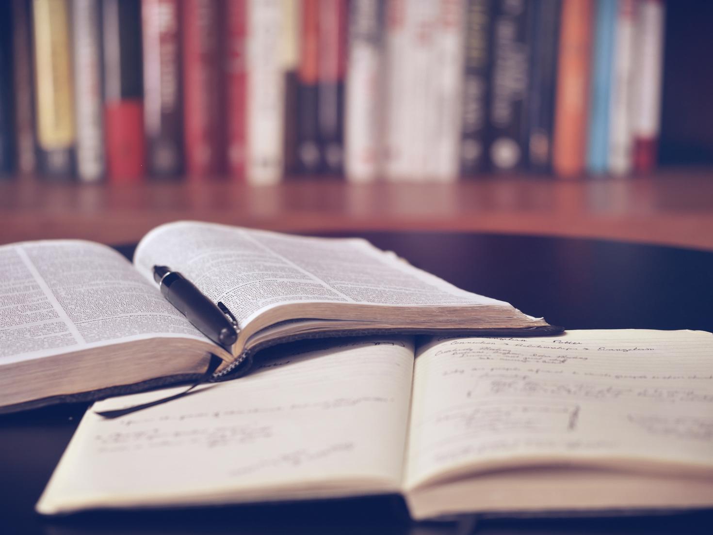 open textbooks on desk