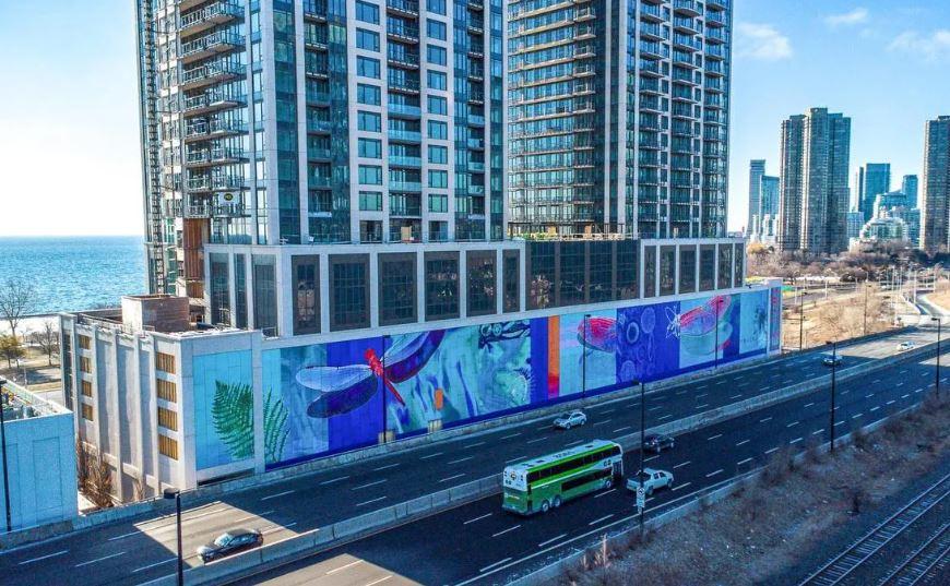 colourful graffiti at the base of a building