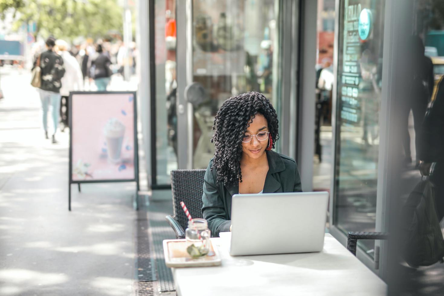 PhD student on laptop at cafe