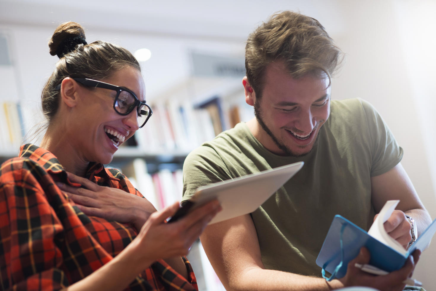 Students sitting together, laughing.