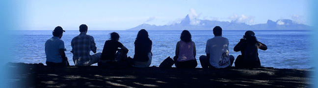 Students sitting with their backs to us looking out on the world