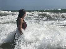 Picture of Emilie on a beach