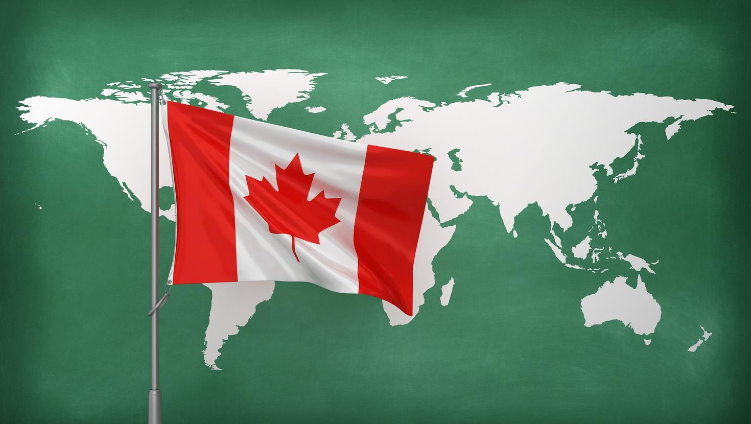 Canadian flag in front of world map