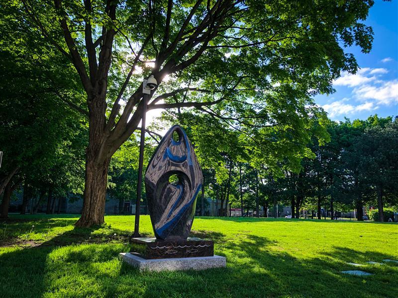 the striking sculpture She Dances with the Earth, Water, and Sky by Mohawk and Oneida artist David General