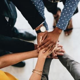 hands of many united together in middle