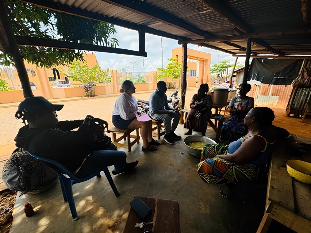 People sitting and chatting in Africa.