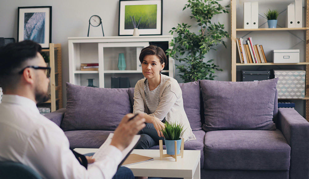 therapist listening to a patient ib an office