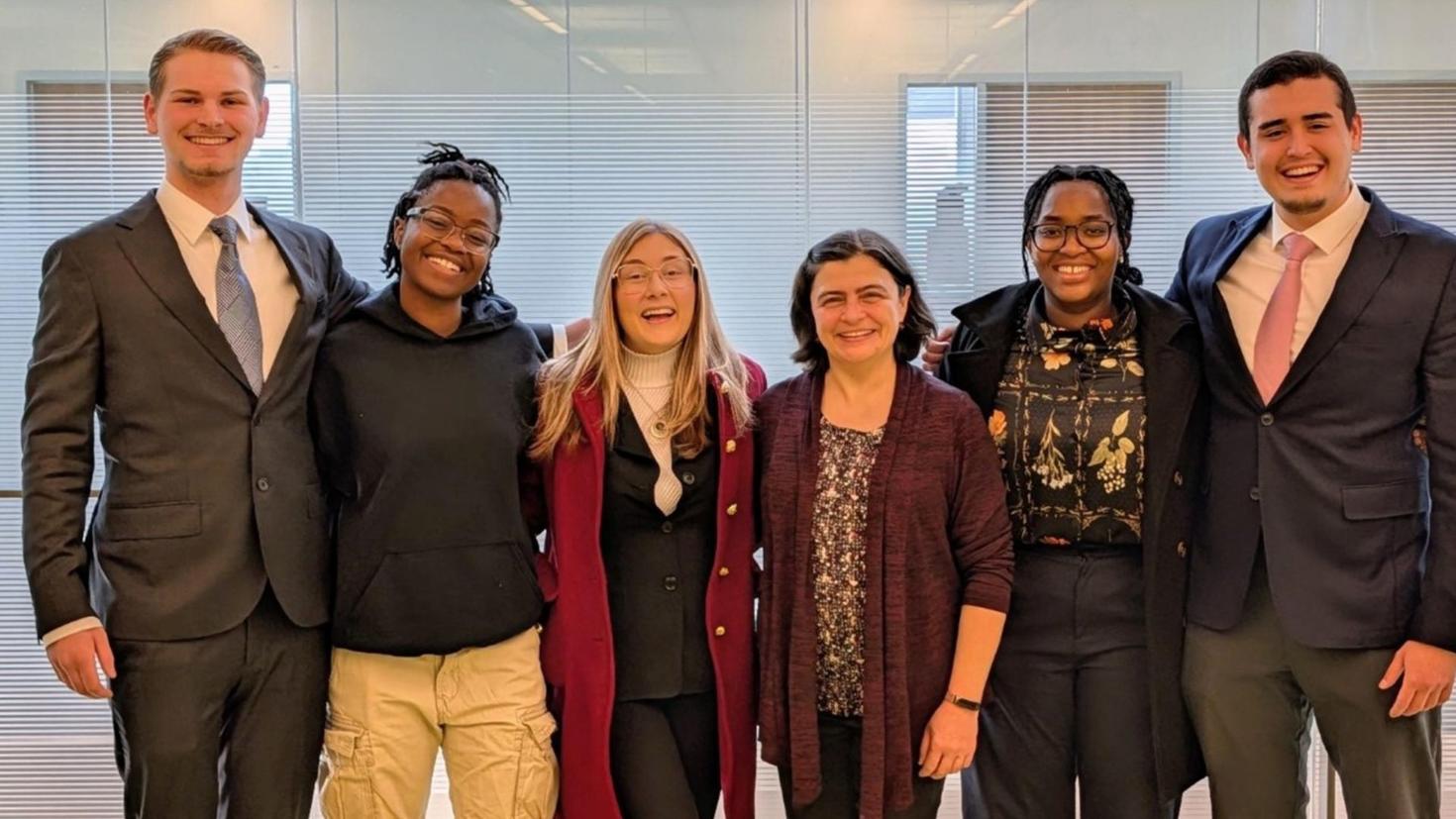 UOttawa presenting team and coach. From Left-to-Right: Declan Green, Mimi Moyo, Rochelle Larivière, Professor Lilia Karnizova, Divine Rubayiza, and Can Ayas.