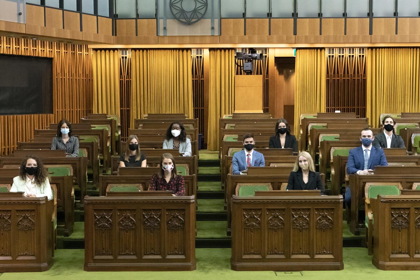 Interns sitting in the Chamber of Commons