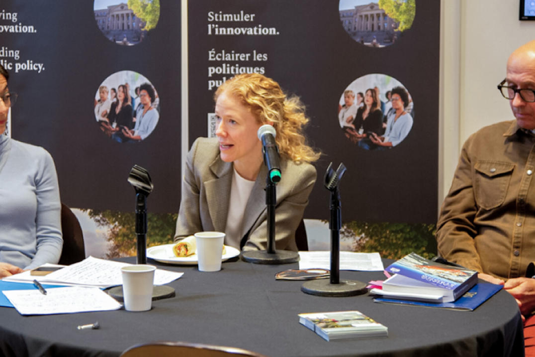 Julie St-Pierre answering a question from the audience.