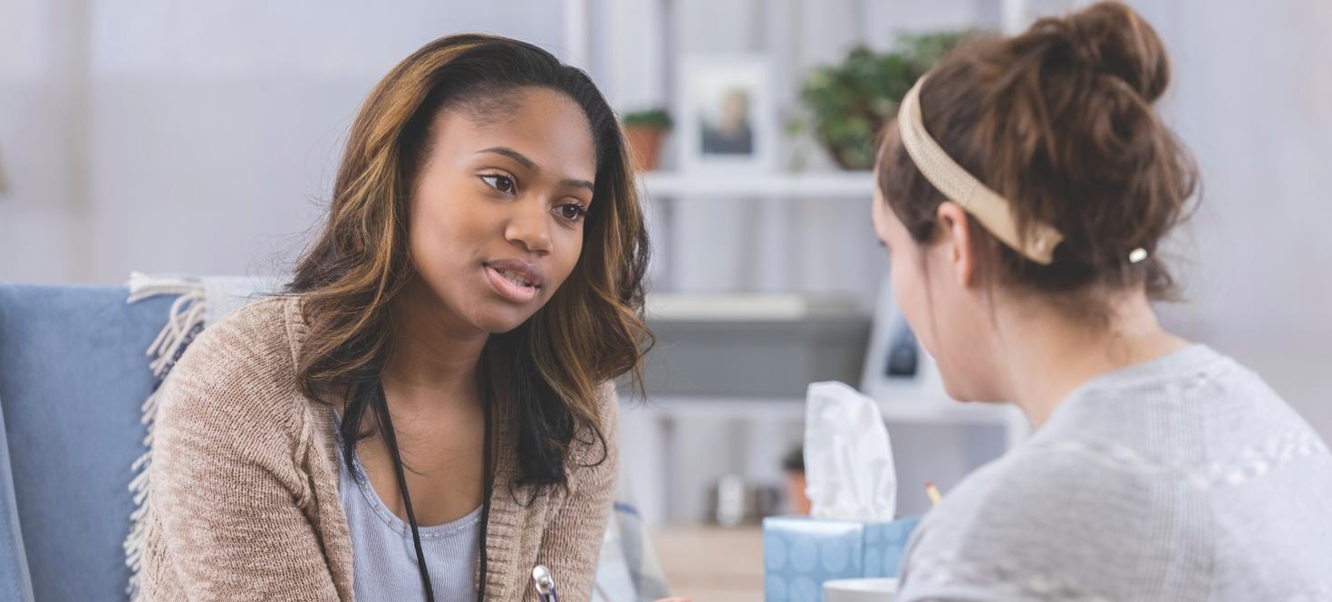 Social worker with student in training.